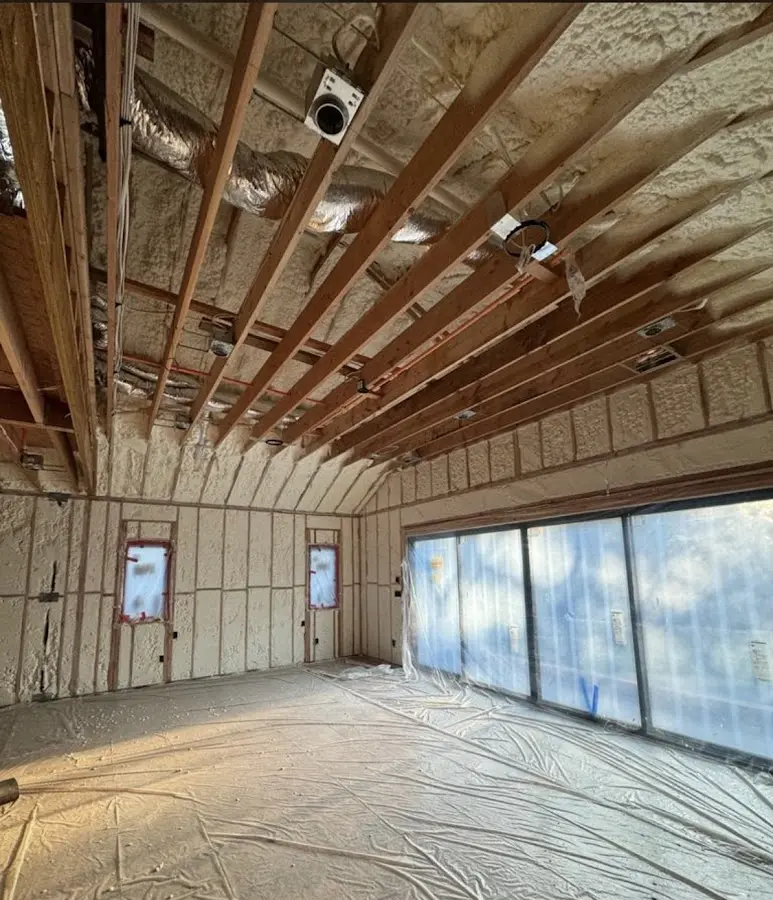 Interior walls and ceiling insulated with spray foam during new construction in Norwood